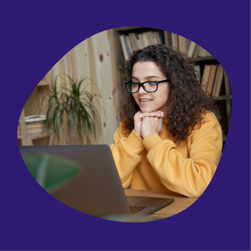 A student reads something on her laptop