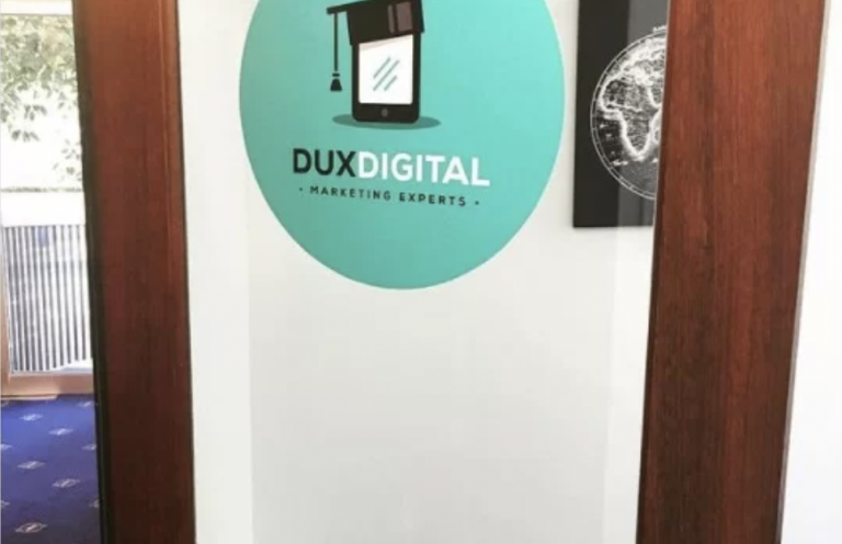 Instagram post of Dux's old office door and logo